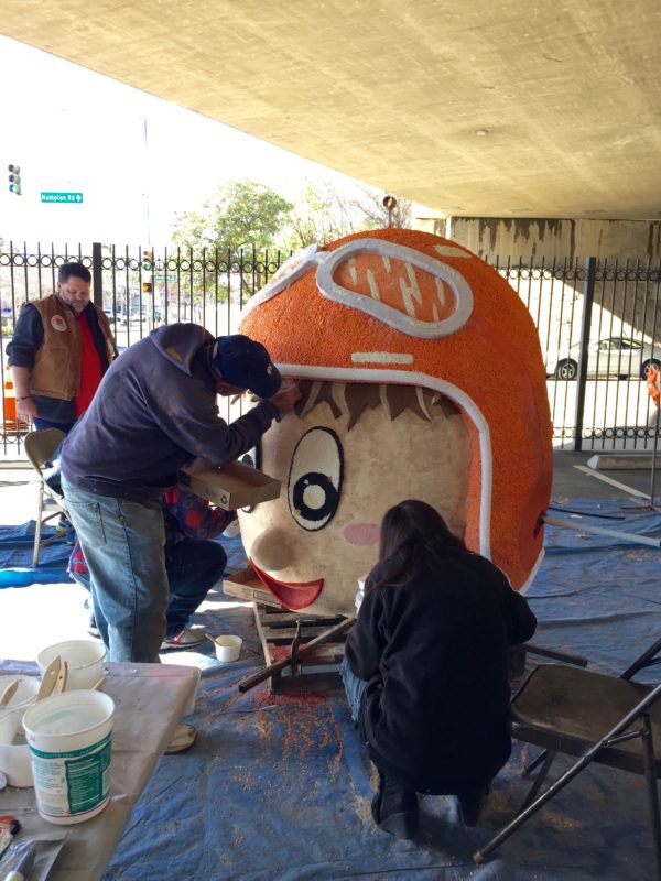 decorating a rose parade float