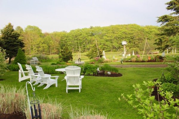 adirondack chairs on a lovely green lawn