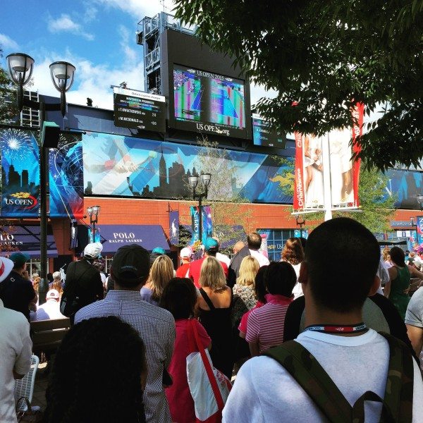 The crowd watching in amazement as Serena Williams loses to Roberta Vinci