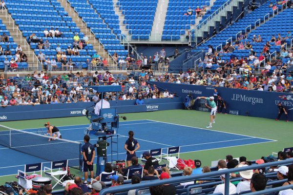 Sam Querrey serving during the mixed doubles match of the US Open