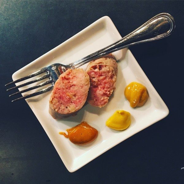 A sample of bratwurst and three mustards. Photo by Sheena