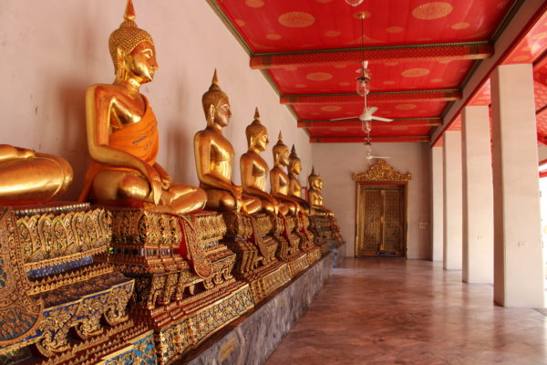 Golden buddhas in a shrine is just one of Ten reasons to visit Thailand.