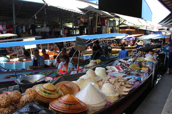 Ten reasons to visit Thailand and a colorful boat at the floating market.