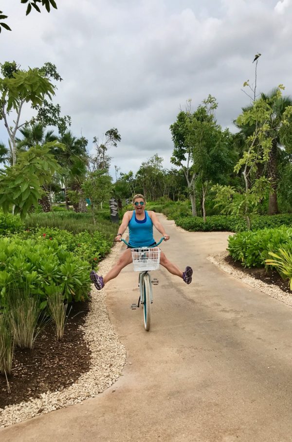 Riding an adorable bike at the Andaz Mayakoba Resort