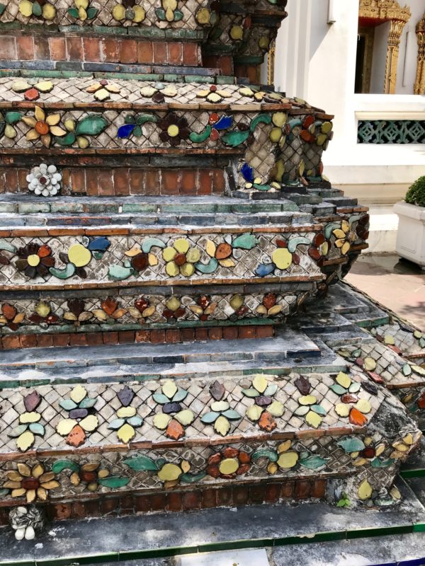 Ten reasons to visit Thailand - seeing the ancient tile up close on a temple.