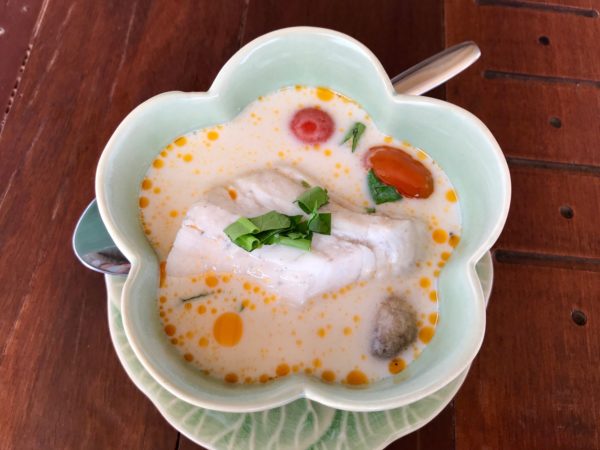 Thai-coconut-soup-with-sea-bass-in-a-green-flower-bowl Delicious coconut soup is one of the ten reasons to visit Thailand.
