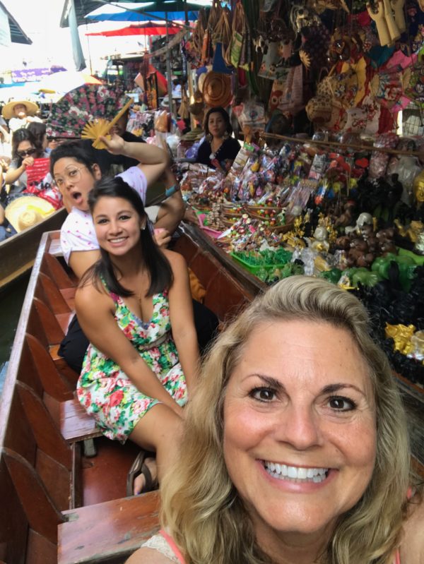 Ten reasons to visit Thailand and sitting in a boat at the floating market.