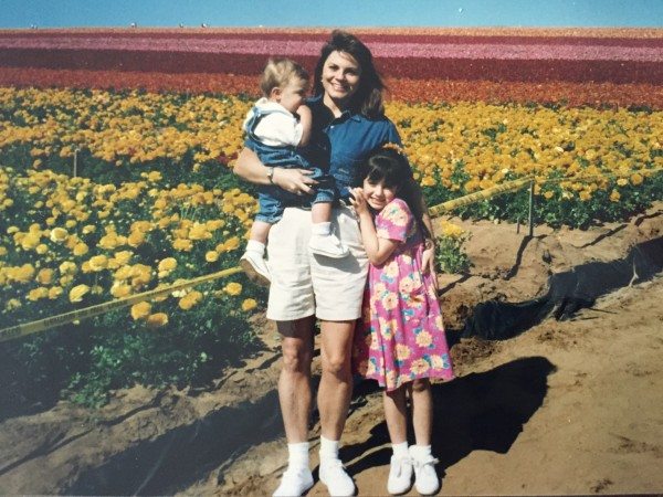 A young mom in the flower fields.